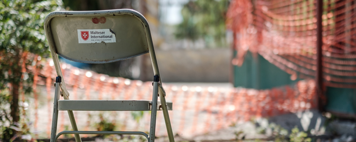 0-Neutral-1 chair with MI logo - picture was taken in Haiti